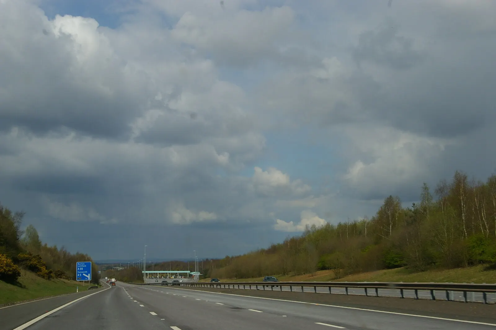 documentary photograph of the M6 Toll southbound toll plaza at Weeford. Original page: https://commons.wikimedia.org/wiki/File:M6_Toll,_southbound_toll_plaza_-_geograph.org.uk_-_7139872.jpg. Photographer: Christopher Hilton, 2 April 2022. License: CC BY-SA 2.0. Attribution: “M6 Toll: southbound toll plaza” by Christopher Hilton, via Geograph Britain and Ireland, CC BY-SA 2.0; unmodified.