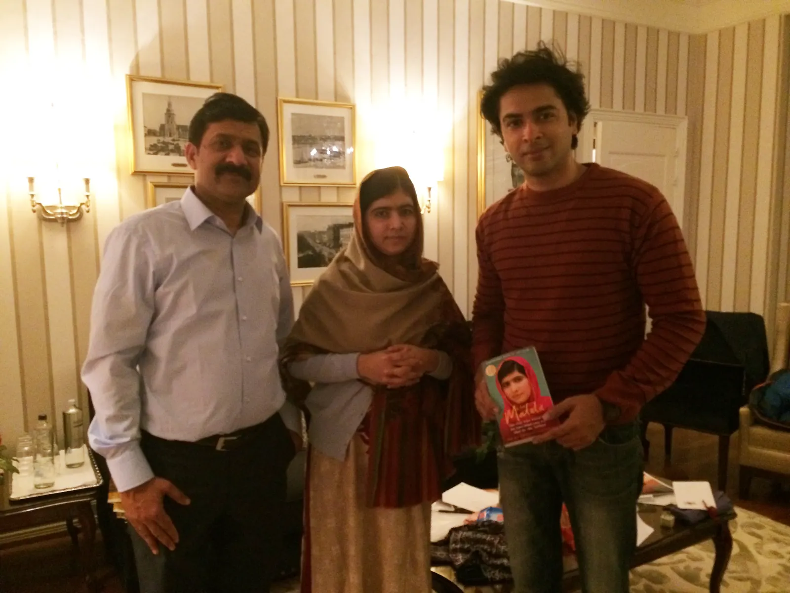 documentary photograph of Malala Yousafzai with Shehzad Roy in Oslo in December 2014, the year she received the Peace Prize at age 17. Creator: Faisalahmedqureshi. [Wikimedia Commons file page](https://commons.wikimedia.org/wiki/File:Shehzad_Roy_and_Malala_Yousafzai_at_the_Nobel_Peace_Prize_Ceremony.JPG). CC BY-SA 4.0; attribution and share-alike terms apply; [license](https://creativecommons.org/licenses/by-sa/4.0/). No edits.