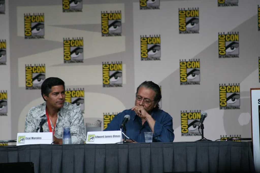 documentary photograph of actors Esai Morales (*Caprica*) and Edward James Olmos (*Battlestar Galactica*) at San Diego Comic-Con, 24 July 2009. Original page: https://commons.wikimedia.org/wiki/File:Esai_Morales_%28Caprica%29_and_Edward_James_Olmos_%28BSG%29.jpg. Photographer: Kari Haley. License: CC BY-SA 2.0. Attribution: Kari Haley, CC BY-SA 2.0, via Wikimedia Commons; no edits.