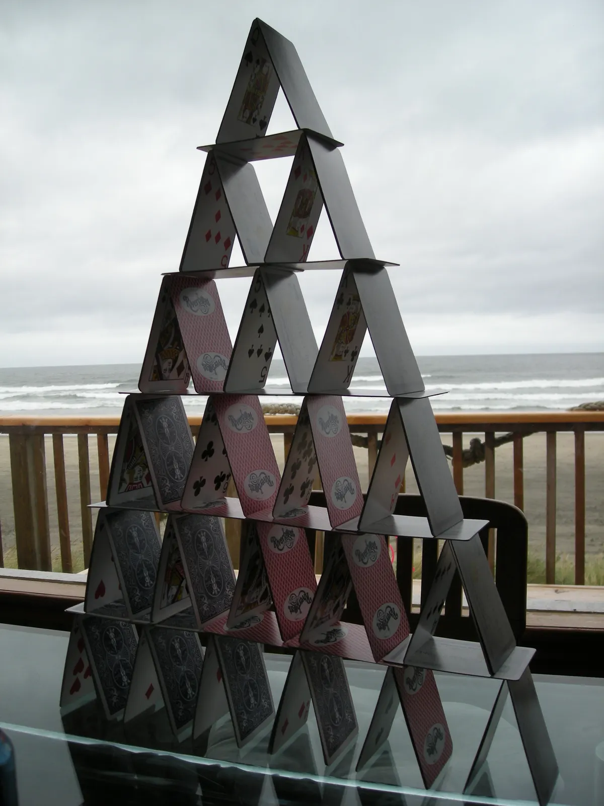 documentary photograph of a six-storey house of cards made from 3.5 decks; not Bryan Berg’s 1992 record structure. Original page: https://commons.wikimedia.org/wiki/File:Card_castle6.JPG. Creator Merzperson (English Wikipedia). Dedicated to the public domain by its author. Attribution is not required; courtesy credit: Merzperson via Wikimedia Commons.