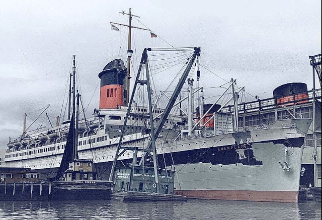 SS Champlain at New York in 1939, being repainted; photographer/upload author niala. CC BY-SA 4.0. Source: https://commons.wikimedia.org/wiki/File:Paquebot_Champlain_en_1939.jpg. Unmodified reproduction. This is the ship in a later year, not the 1934 arrival.
