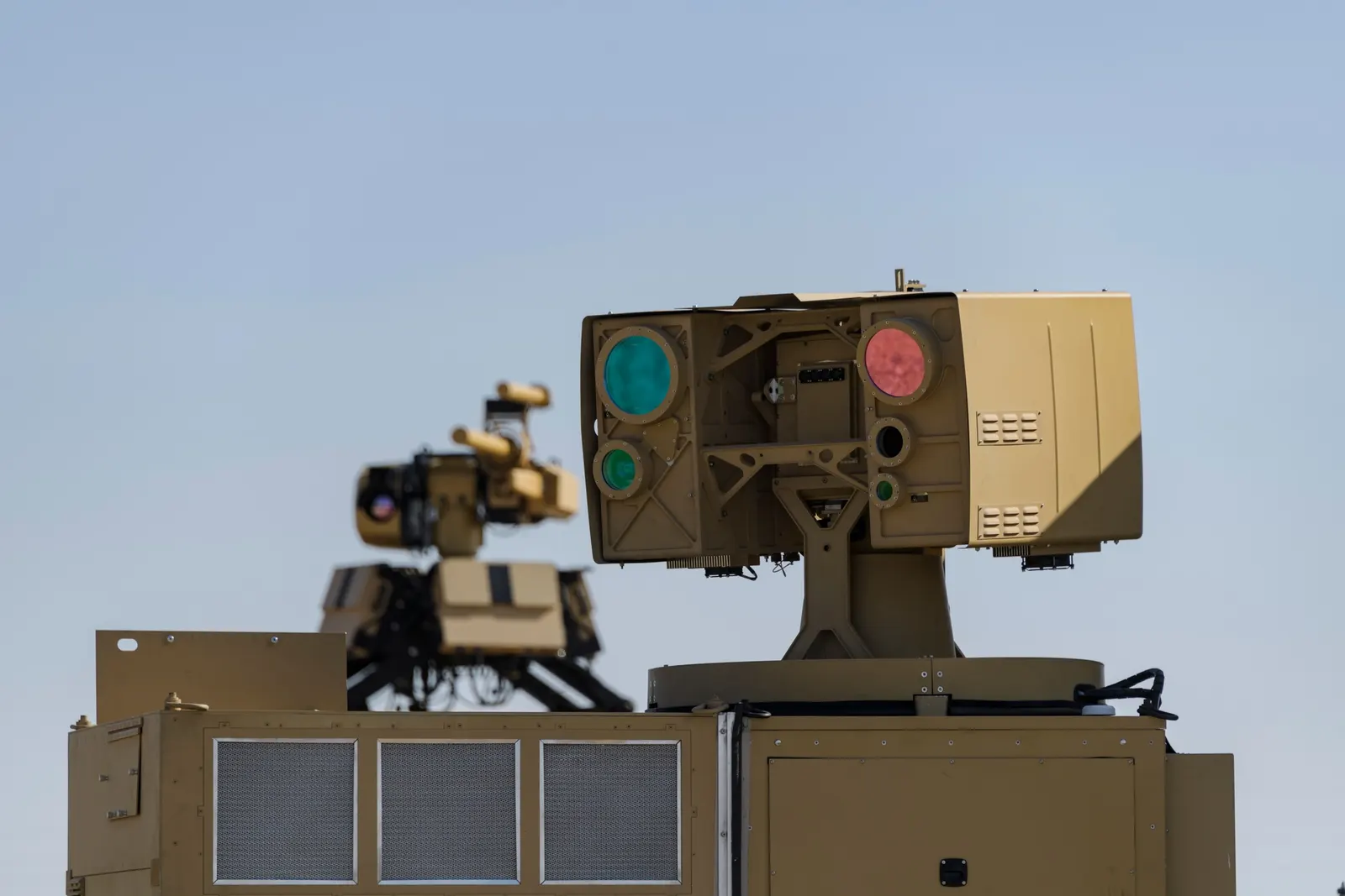 Palletized High Energy Laser system at Yuma Proving Ground, Arizona, 25 April 2022. Original asset page: https://www.dvidshub.net/image/7262364/ypg-supporting-high-energy-lasers-combat. Photographer: Brandon Mejia, U.S. Army Yuma Proving Ground. DVIDS asset page explicitly labels image PUBLIC DOMAIN. Attribution: “U.S. Army photo by Brandon Mejia / DVIDS.” Downloaded 2000-pixel display rendition; no other edits.