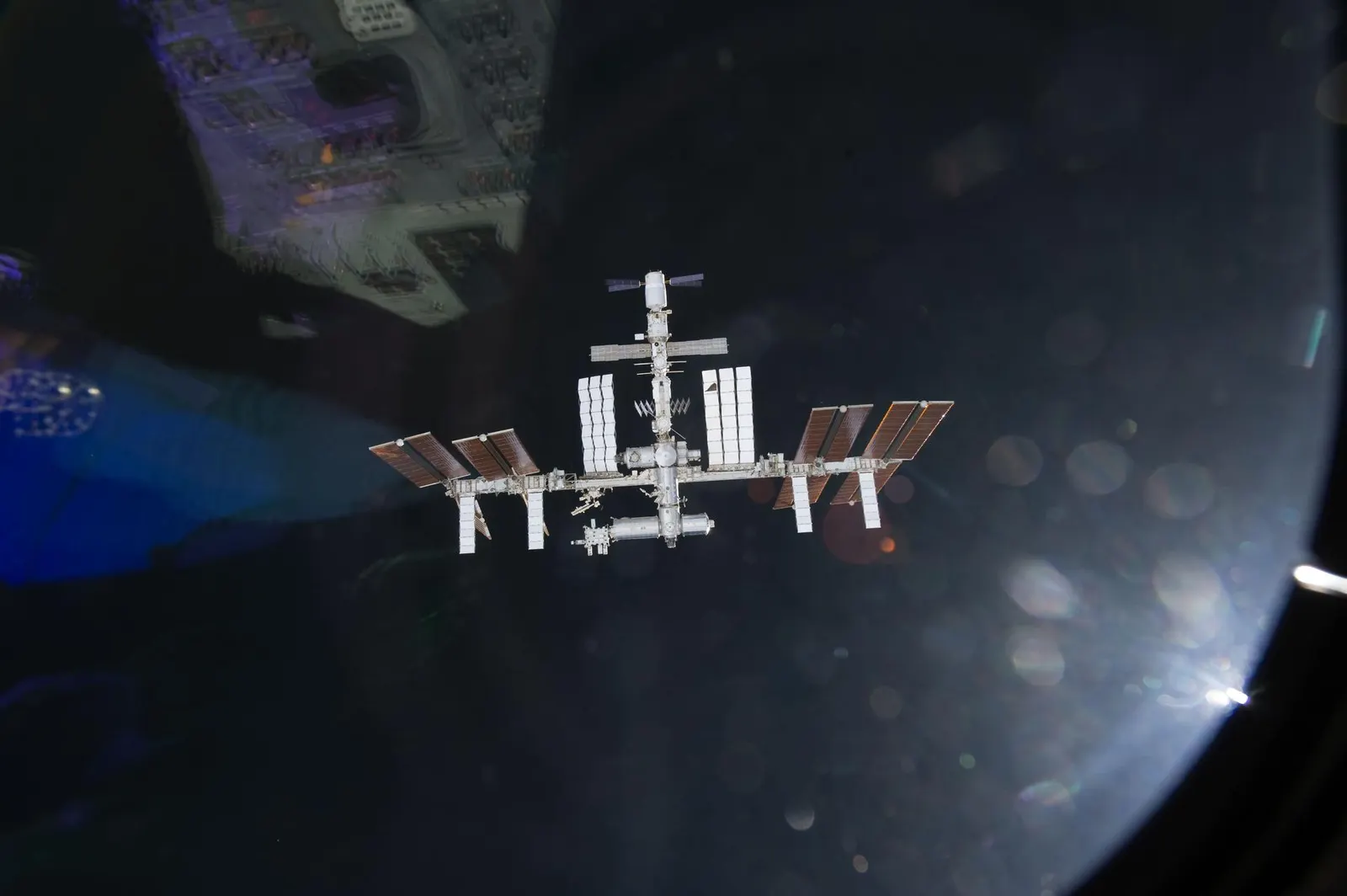 NASA image S134E006921, the International Space Station photographed from Space Shuttle Endeavour during approach, 2011. NASA credit; U.S. federal public-domain work. Source: https://images-assets.nasa.gov/image/s134e006921/s134e006921~large.jpg. Documentary orbit context.