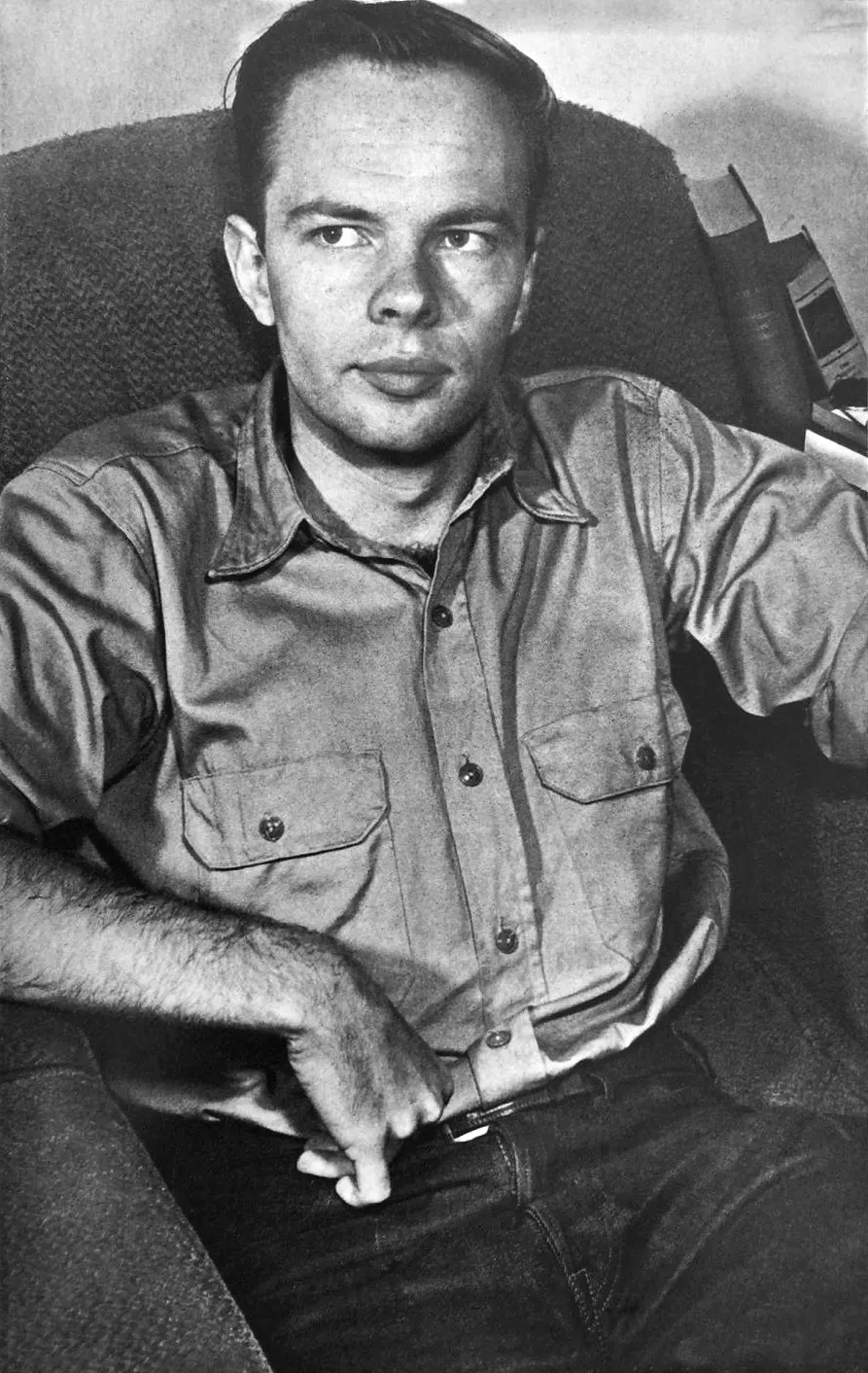 documentary portrait of Philip K. Dick, made by Arthur Knight and published in a 1962 book edition. Wikimedia Commons marks it public domain in the United States because the original publication lacked the required copyright notice. Original file page: https://commons.wikimedia.org/wiki/File:Philip_K_Dick_in_early_1960s_(photo_by_Arthur_Knight).jpg. No attribution required by the stated US status; source credit retained here. Image visually inspected.