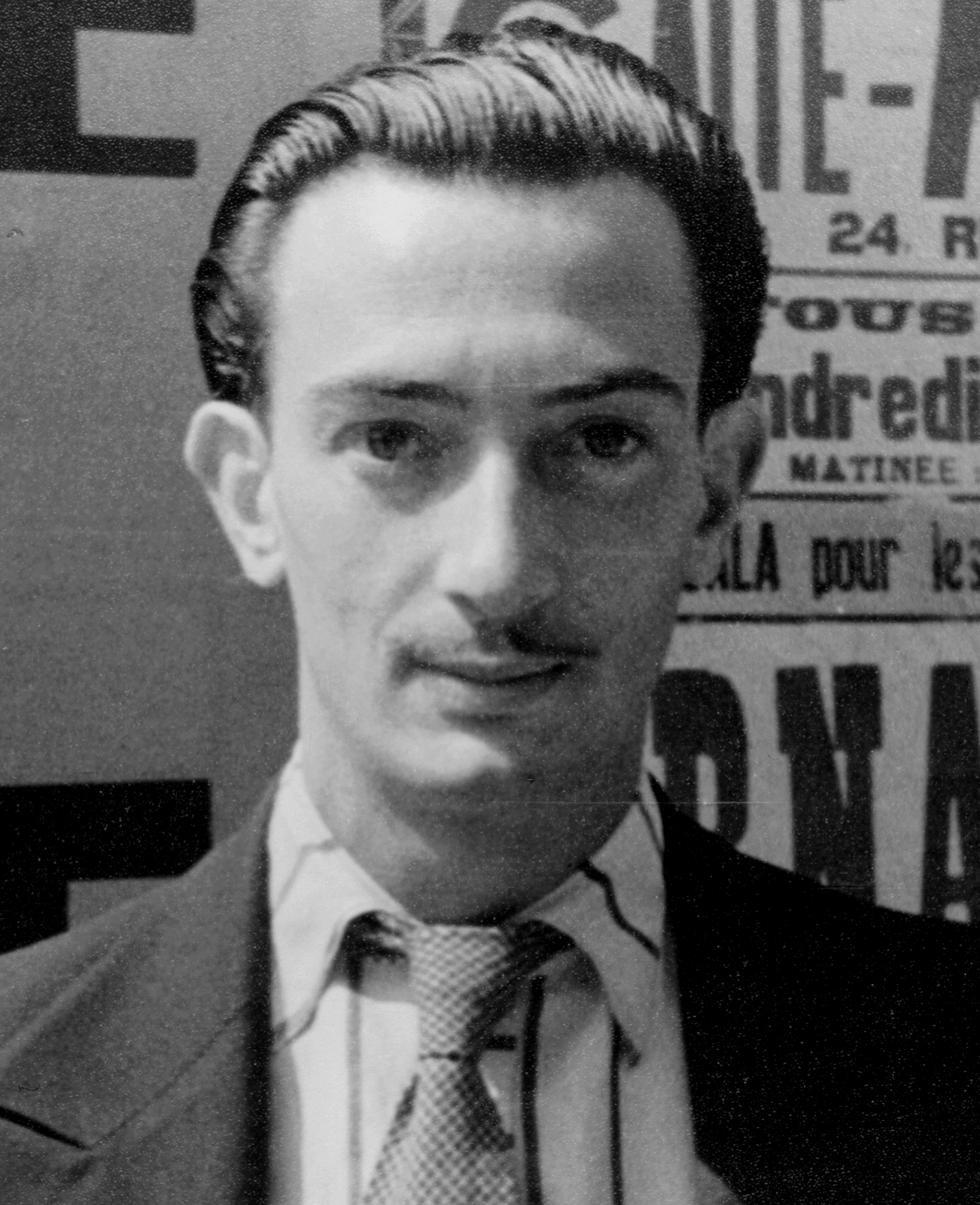 portrait of Salvador Dalí on 16 June 1936; useful subject context, but it does not show the diving-suit lecture. Original asset page: https://commons.wikimedia.org/wiki/File:Portrait_of_Salvador_Dali,_Paris,_LOC_4483943847_(cropped).jpg. Photographer: Carl Van Vechten. The file page identifies the Library of Congress Carl Van Vechten Photographs collection and marks it public domain. No edits.