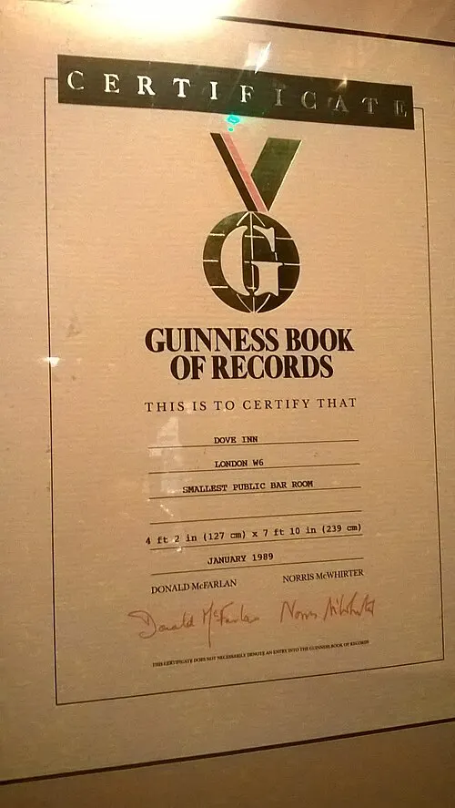 1989 Guinness Book of Records certificate for the smallest public bar room, displayed at the Dove in Hammersmith; a record-related artifact, not an annual GWR Day event. Photographer RioVerde; Wikimedia Commons, https://commons.wikimedia.org/wiki/File:Dove,_Hammersmith,_Guinness_Book_of_Records_Certificate_October_2017.jpg; CC BY-SA 4.0 (https://creativecommons.org/licenses/by-sa/4.0/). Attribution: RioVerde, via Wikimedia Commons, CC BY-SA 4.0. Original file; checked 2026-10-18.