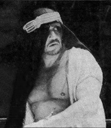 documentary image of professional wrestler The Sheik (Ed Farhat) on the 1972 *Body Press Wrestling Magazine* cover; it is a period wrestling-context image, not a photo of the McCrary brothers. Original page: https://commons.wikimedia.org/wiki/File:The_Sheik_-_1972_BODY_PRESS_WRESTLING_MAGAZINE.jpg. Creator is not identified on the source page. CC BY-SA 4.0 is stated on the Commons file page; attribution: “The Sheik - 1972 BODY PRESS WRESTLING MAGAZINE.jpg,” Wikimedia Commons, CC BY-SA 4.0. Original scan was sourced from the magazine listing linked on that page; no creator is claimed.