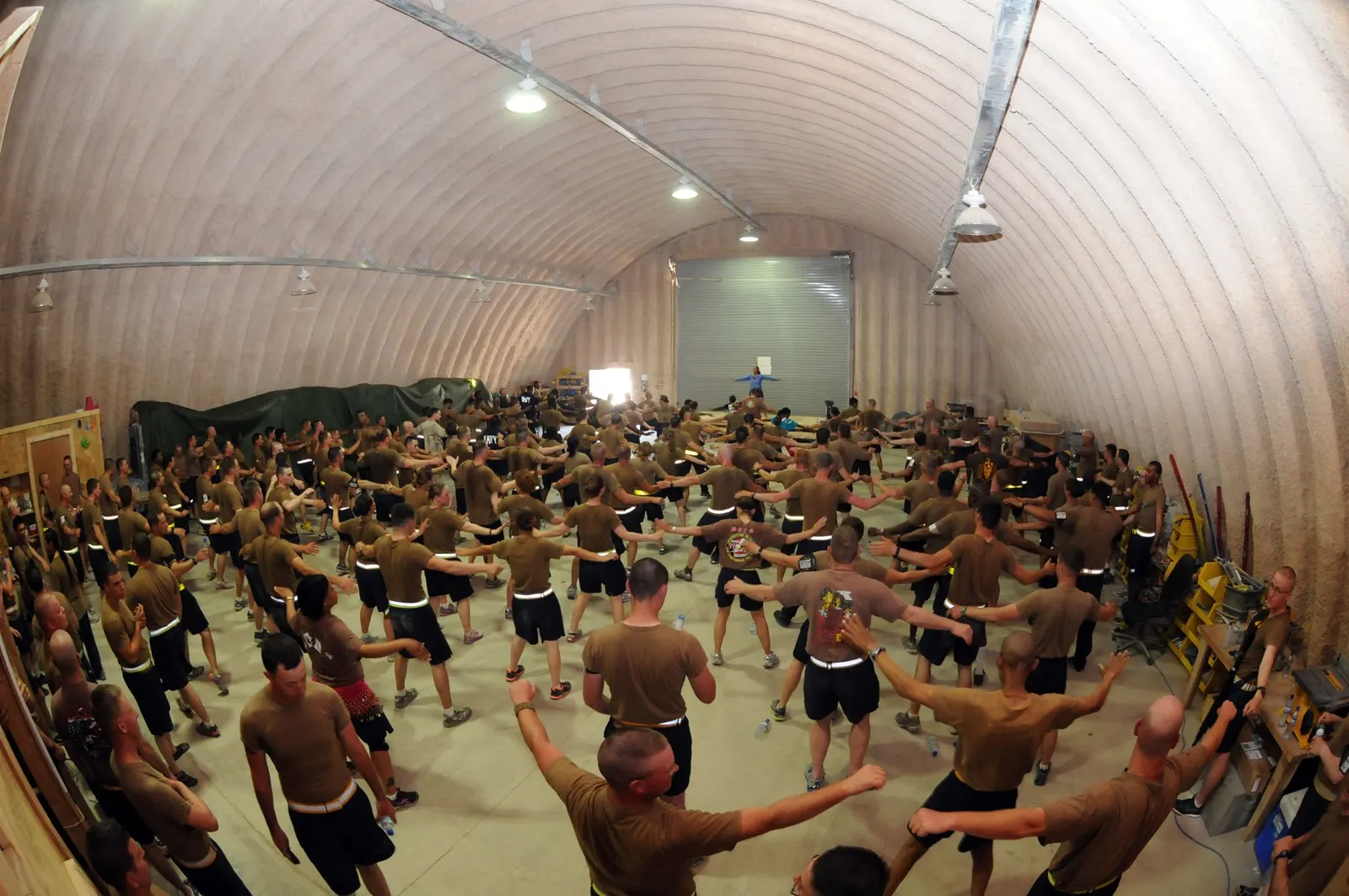 Seabees taking part in a Zumba exercise session in Helmand Province, Afghanistan, 28 April 2012; photographer MC1 Jonathan Carmichael/U.S. Navy; U.S. federal government work, public domain. Source and credit: https://commons.wikimedia.org/wiki/File:Flickr_-_Official_U.S._Navy_Imagery_-_Seabees_participate_in_a_Zumba_dance-exercise_session_as_part_of_Sexual_Assault_Awareness_Month..jpg.