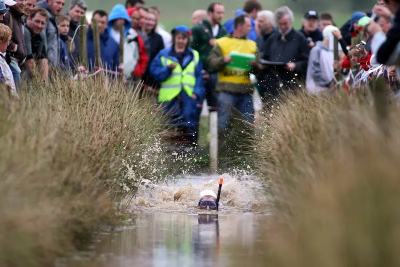 documentary photograph of a competitor at the World Bog Snorkelling Championship at Waen Rhydd peat bog, near Llanwrtyd Wells, taken 25 August 2008. Contextual bog-snorkelling image, not the specific triathlon or Daniel Bent’s record attempt. Photographer Rutger Geerling (Fotograferen.net), uploaded by Rud-gr; licensed CC BY-SA 3.0 (also GFDL); attribution: “Rutger Geerling (Fotograferen.net) / CC BY-SA 3.0”; unedited. [Original file page](https://commons.wikimedia.org/wiki/File:RUD_2821_resize.JPG).
