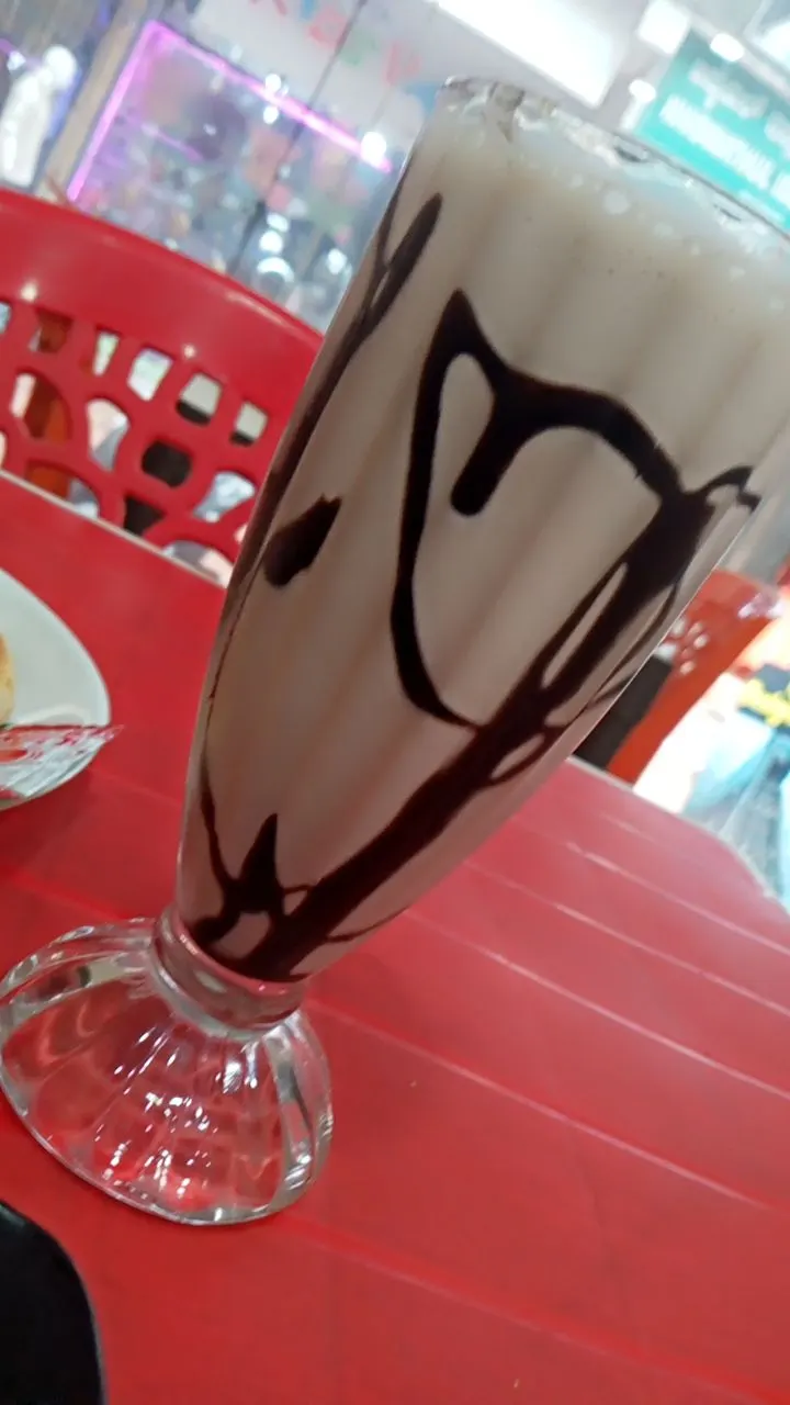 documentary photograph of a chocolate milkshake in a glass; it is not Bashaw’s mixture or the record sample. Original page: https://commons.wikimedia.org/wiki/File:Chocolate_milkshake.jpg. Creator Hegde Neha. CC BY-SA 4.0 (https://creativecommons.org/licenses/by-sa/4.0/). Attribution: Hegde Neha, “Chocolate milkshake,” CC BY-SA 4.0, via Wikimedia Commons. Original JPEG, unchanged.