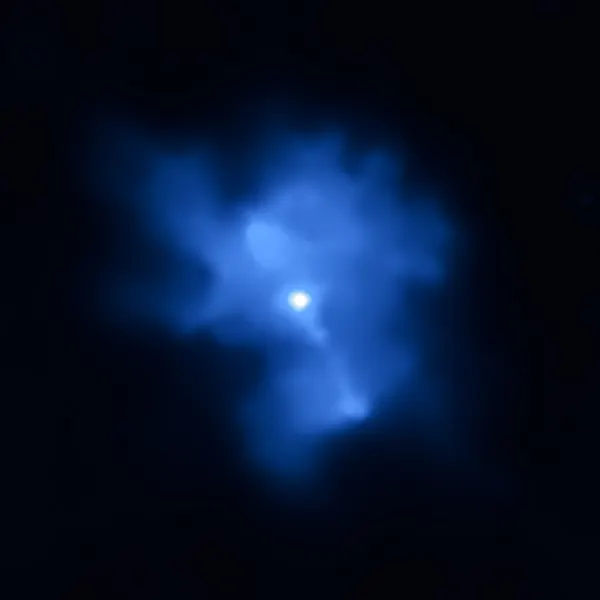 Chandra X-ray image of the Kes 75 pulsar, a bright neutron star at the center of the surrounding blue pulsar-wind nebula.