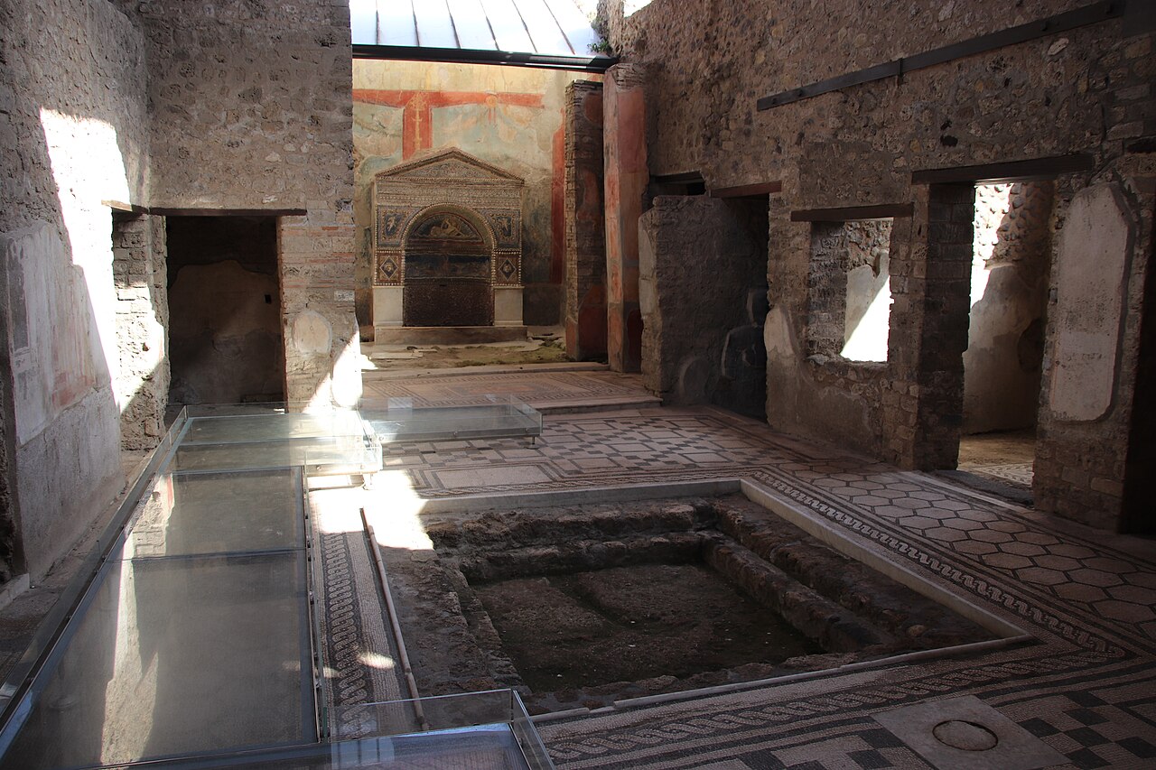 Photograph of the House of the Bear in Pompeii, showing its impluvium and fountain; contextual Roman domestic architecture, not a location identified by the ancient account. Wikimedia Commons, Public Domain: https://commons.wikimedia.org/wiki/File:House_of_the_Bear_(Pompeii)_with_Impluvium_and_Fountain_(48441046297).jpg. 1280 × 853 px derivative; checked 2026-10-25.