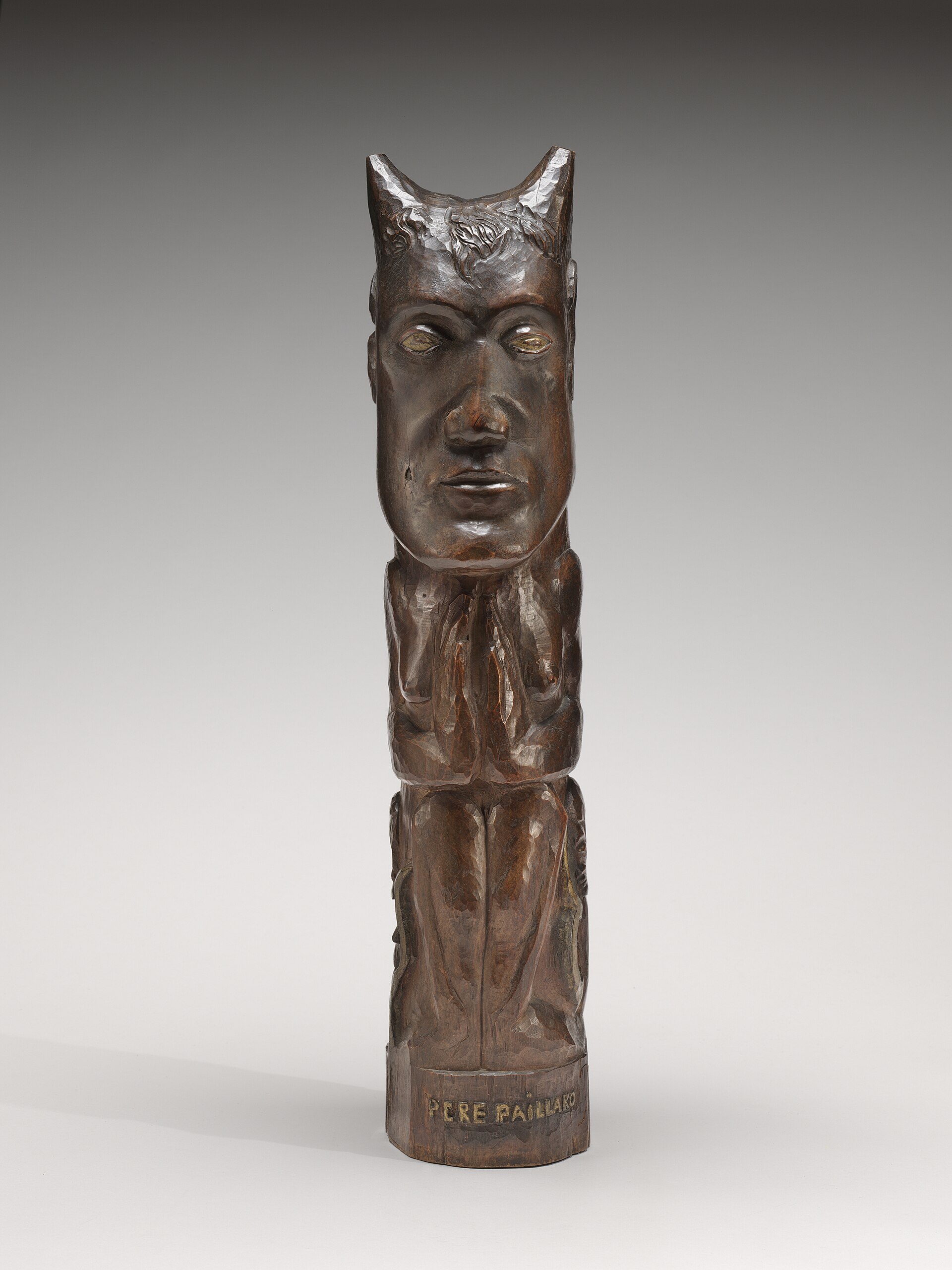 Gauguin’s 1902 painted wooden sculpture *Père Paillard*.