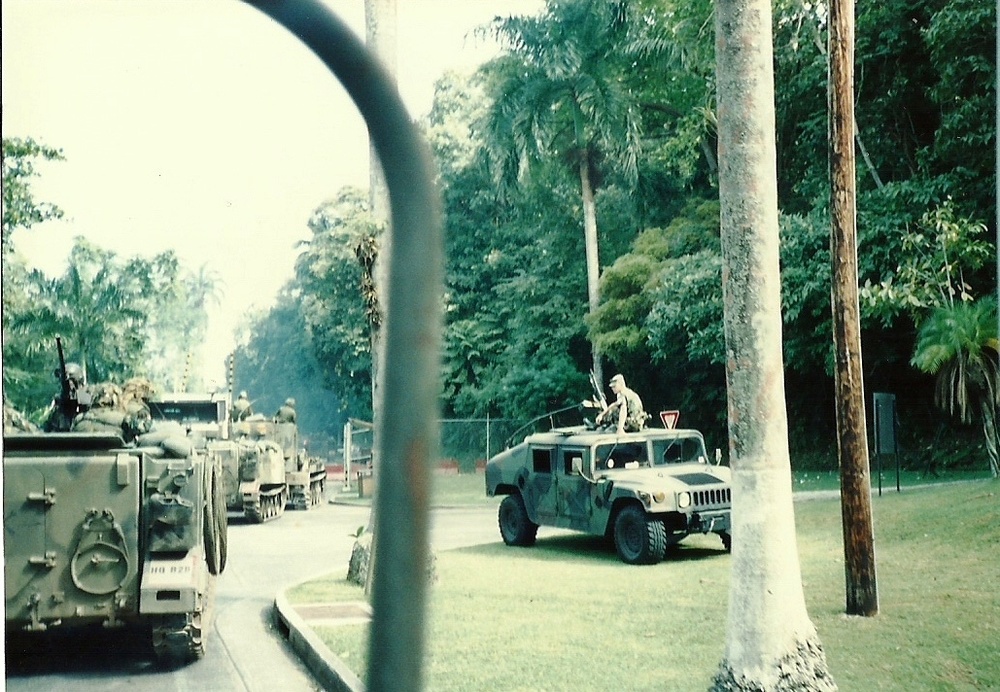 U.S. Army armored vehicles traveling in Panama during Operation Just Cause, December 1989; contextual image, not a photo of the music campaign or the nunciature. South Carolina National Guard archive photo, public domain and cleared for release. DVIDS: https://www.dvidshub.net/image/1705011/sc-national-guard-members-recall-operation-just-cause. No edits.