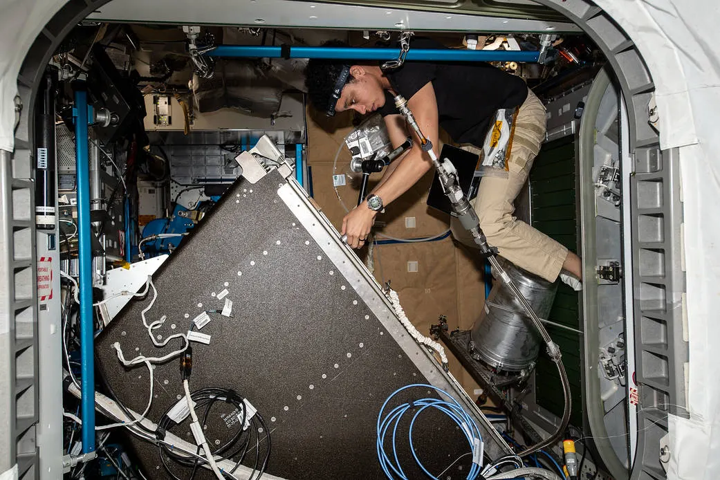 NASA image ISS067E099373, astronaut Jessica Watkins servicing the Water Recovery System rack inside the ISS on 1 June 2022. Source: https://www.nasa.gov/image-article/astronaut-jessica-watkins-services-life-support-components/. NASA credit; public-domain U.S. federal work.