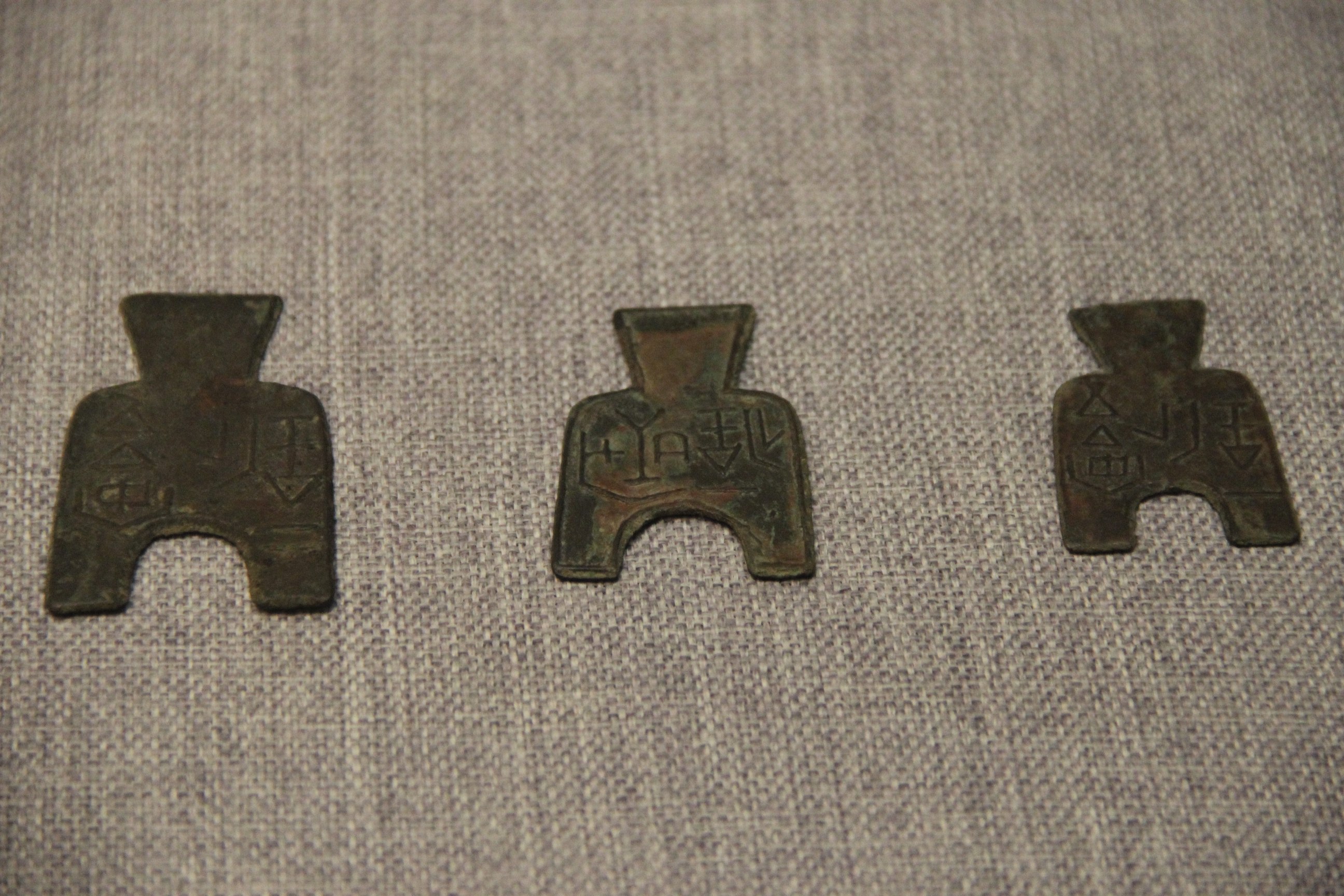 three bronze spade-shaped coins from the Prehistory to Sui Dynasty Gallery, New Luoyang City Museum, Henan.