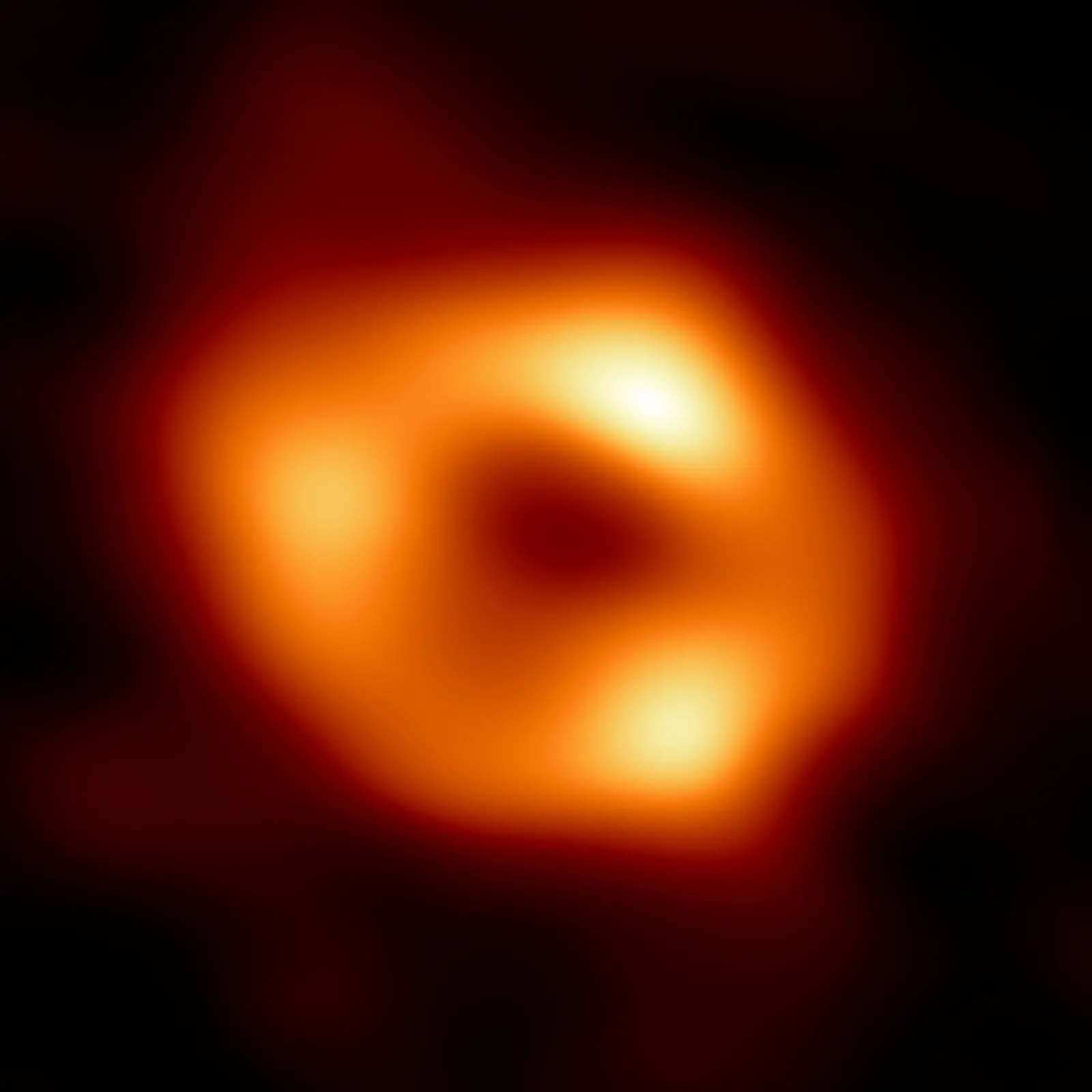 Event Horizon Telescope Collaboration's first image of Sagittarius A*, an averaged reconstruction from 2017 observations, released 2022-05-12. Source: [Wikimedia Commons file page](https://commons.wikimedia.org/wiki/File:Sag_A%2A.jpg). Reproduced from ESO material under [CC BY 4.0](https://creativecommons.org/licenses/by/4.0/). Credit “EHT Collaboration / European Southern Observatory (ESO)” and link the license. Original 4076 × 4076 JPEG downloaded 2026-10-19 without edits. Interferometric reconstruction, not an ordinary camera photograph.