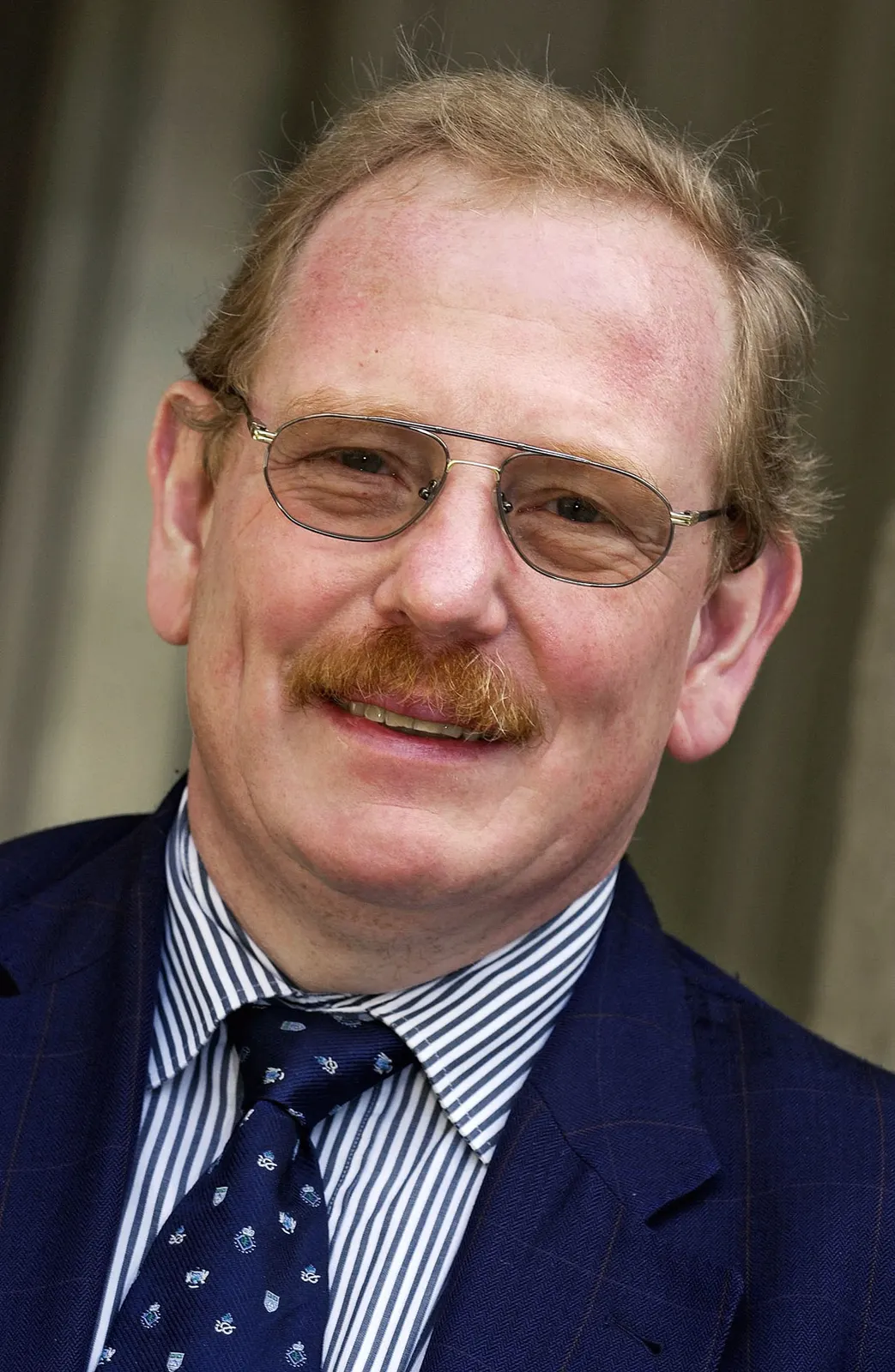 Profile portrait of Reinhard Genzel dated 24 January 2012. Creator Max Planck Institute for Extraterrestrial Physics (MPE). Wikimedia Commons: https://commons.wikimedia.org/wiki/File:Reinhard_Genzel.jpg; CC BY-SA 3.0; attribution and share-alike terms apply; https://creativecommons.org/licenses/by-sa/3.0/. No edits.
