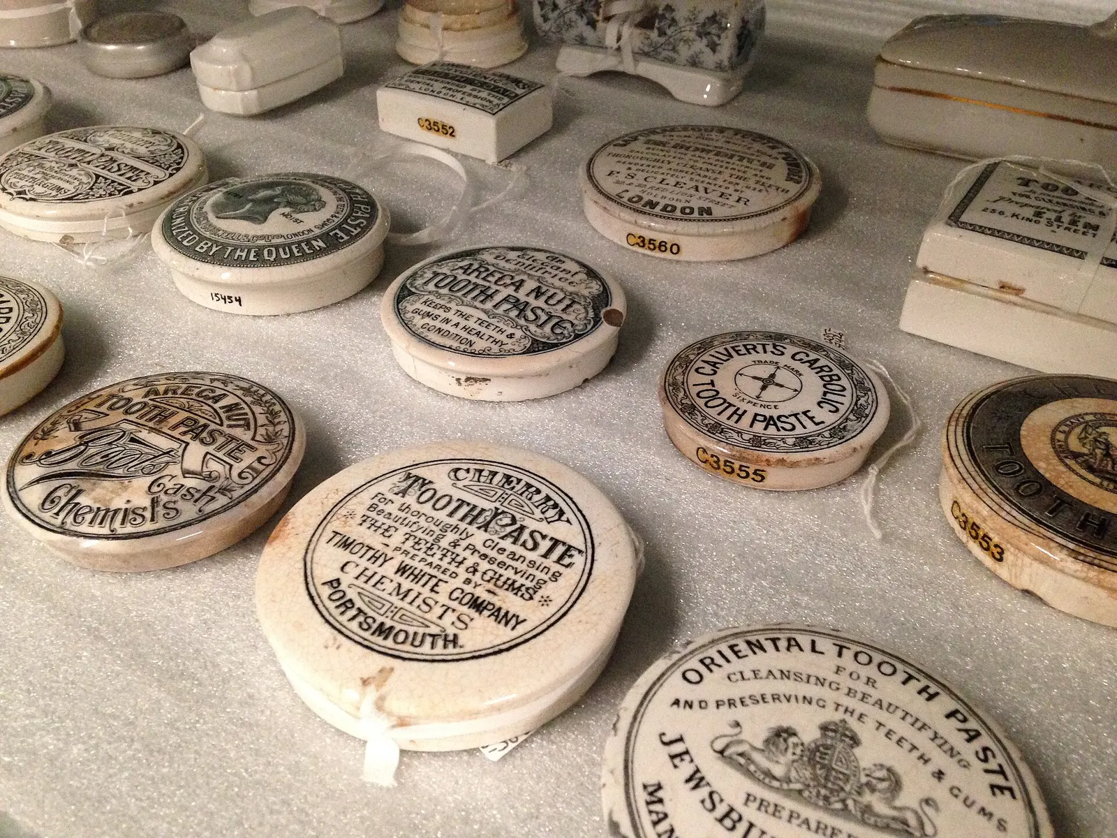 historical toothpaste boxes in the depot of Universiteitsmuseum Utrecht; contextual image, boxes rather than tubes and not Kolpakov’s collection. Sandra Fauconnier (Spinster), Wikimedia Commons, https://commons.wikimedia.org/wiki/File:Toothpaste_boxes_at_the_depot_of_Universiteitsmuseum_Utrecht.jpg, CC BY-SA 4.0 (https://creativecommons.org/licenses/by-sa/4.0/). Attribution: Sandra Fauconnier, “Toothpaste boxes at the depot of Universiteitsmuseum Utrecht,” CC BY-SA 4.0, via Wikimedia Commons. Downloaded from the original Commons file page; resized delivery variant (`?width=1400`). Checked 2026-10-18.
