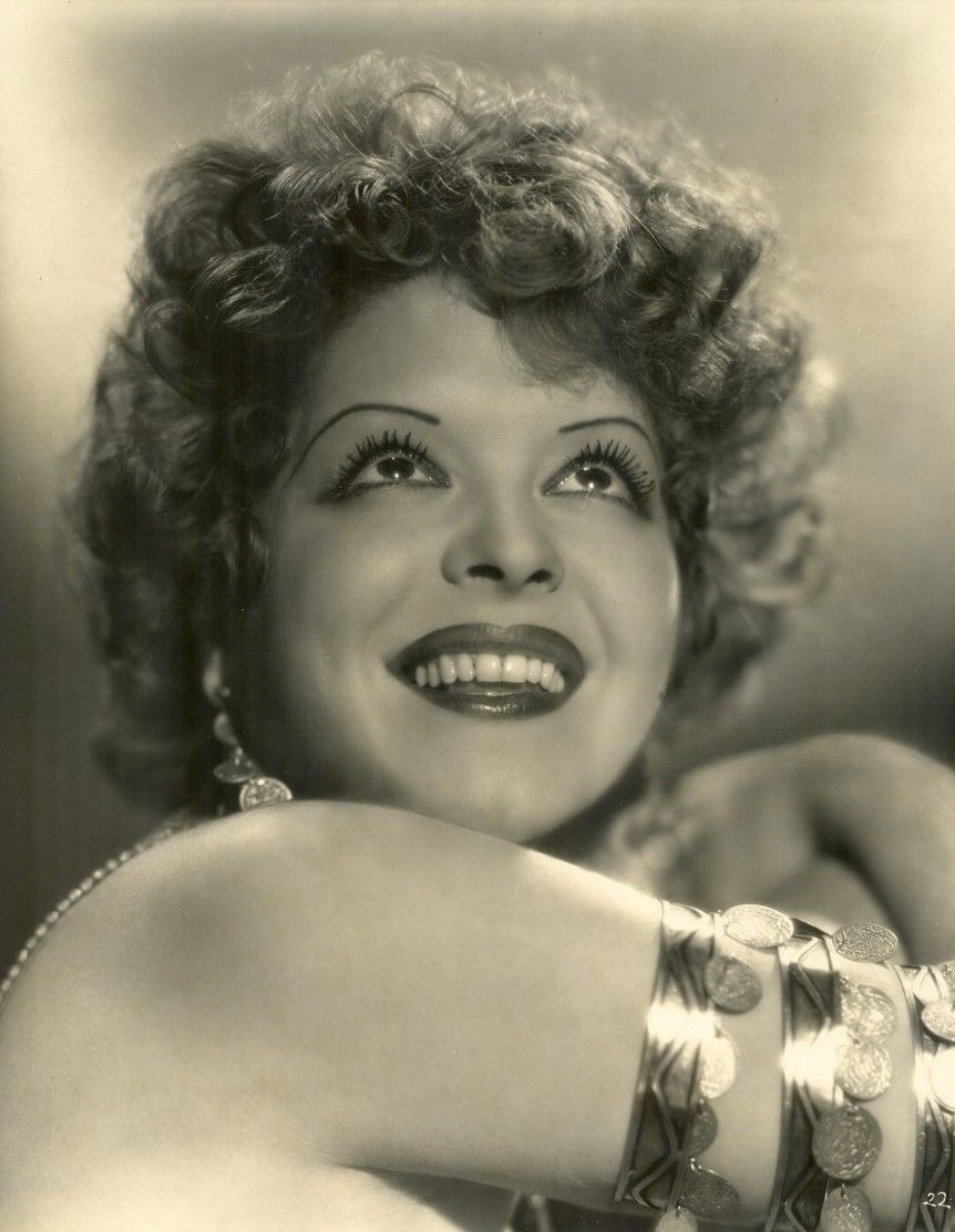 Clara Bow publicity portrait by Otto Dyar, 1920s; public domain in the United States per Wikimedia Commons. Contextual image only; sunglasses are not shown. https://commons.wikimedia.org/wiki/File:Clara_Bow_by_Otto_Dyar,_1920s.jpg