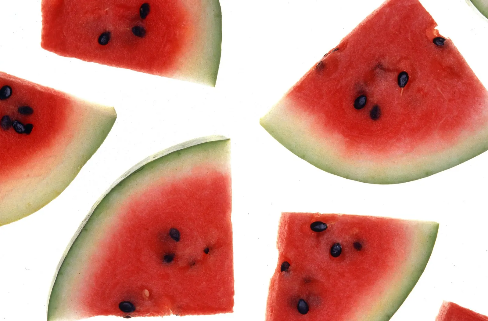USDA photograph of cut watermelon flesh. Author credit: USDA photo by Scott Bauer; public-domain U.S. federal government work. Original Commons record: https://commons.wikimedia.org/wiki/File:Watermelon.jpg. Original 2700×1773 px; resized proportionally to fit 1800 px and saved as optimized JPEG quality 88. Visually inspected 2026-10-18.