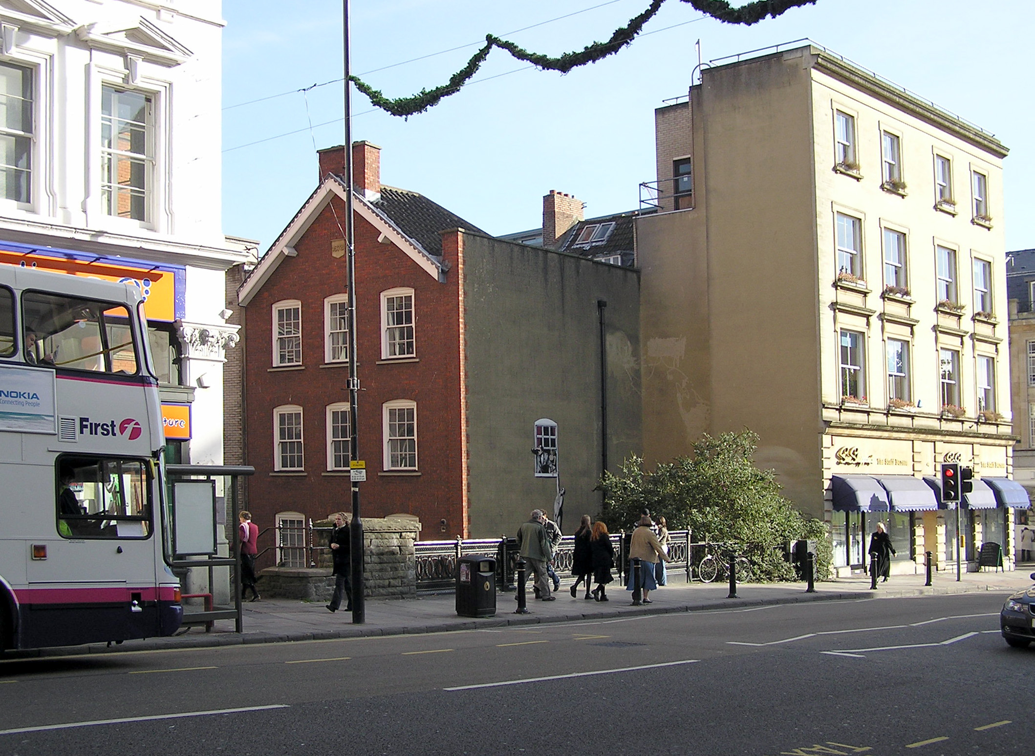Banksy's *Well Hung Lover* on Park Street, Bristol; a documented work by the artist, included to ground the discussion in his street-art practice.
