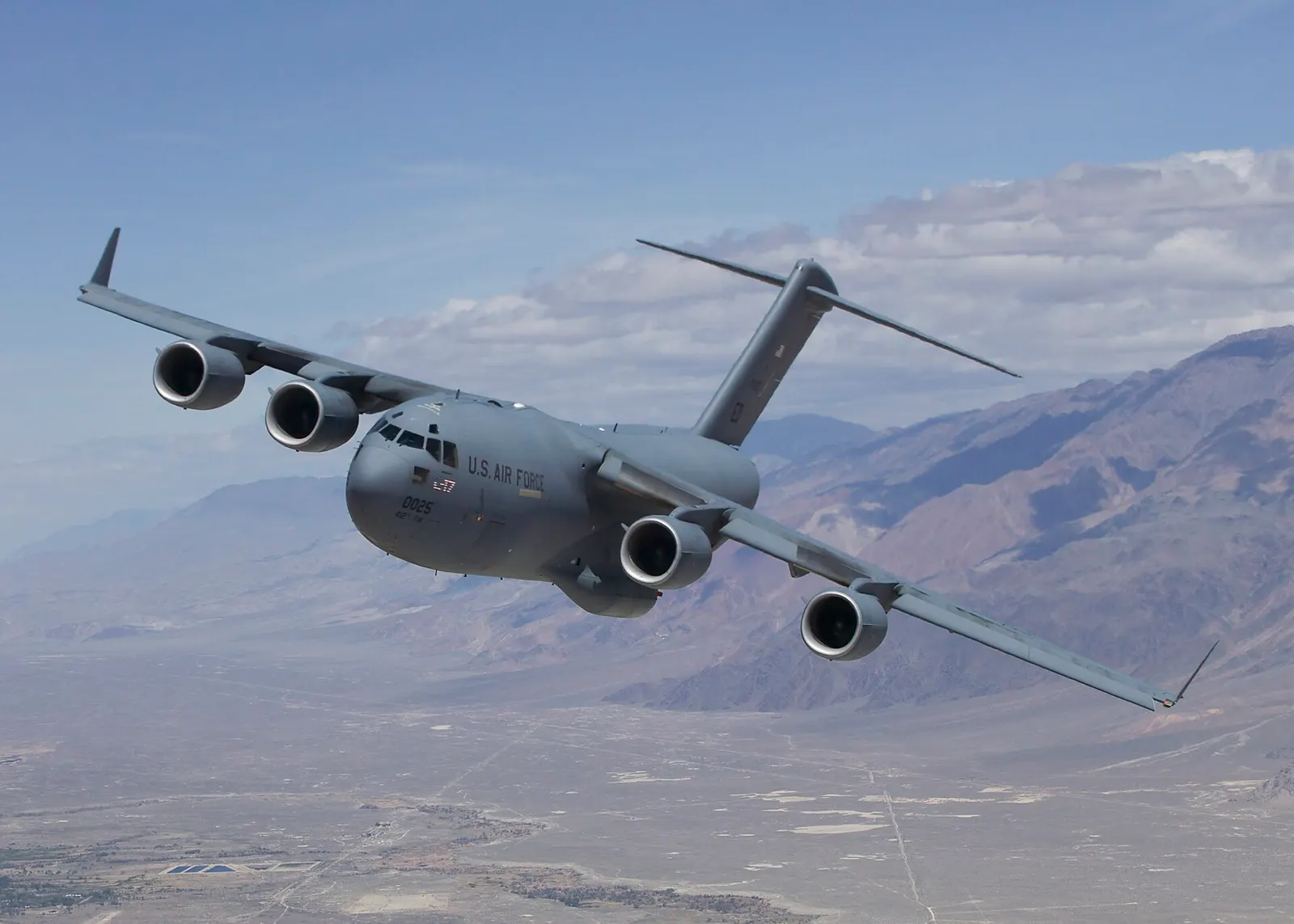 C-17 Globemaster III T-1 on a test sortie over Owens Valley; U.S. Air Force; public domain as a U.S. federal government work. Original page: https://commons.wikimedia.org/wiki/File:C-17_test_sortie.jpg. Credit: U.S. Air Force. Caption clarifies this is not Fast's aircraft or attempt.